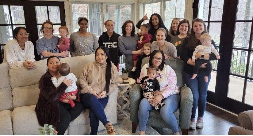 Rachel with the moms and children of her Mom Squad Connect Group gathered in a home