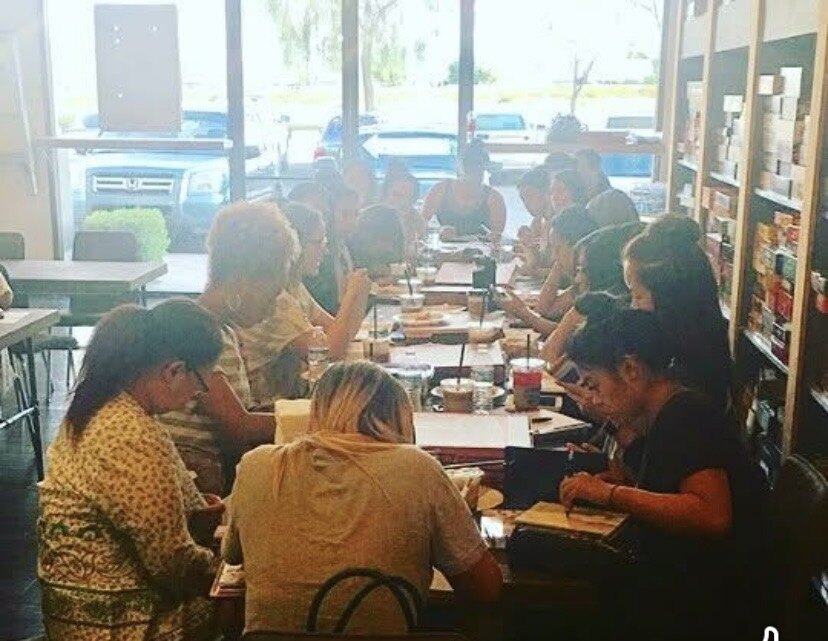 Women studying the Bible together around a table at Rachel's Las Vegas women's Bible study