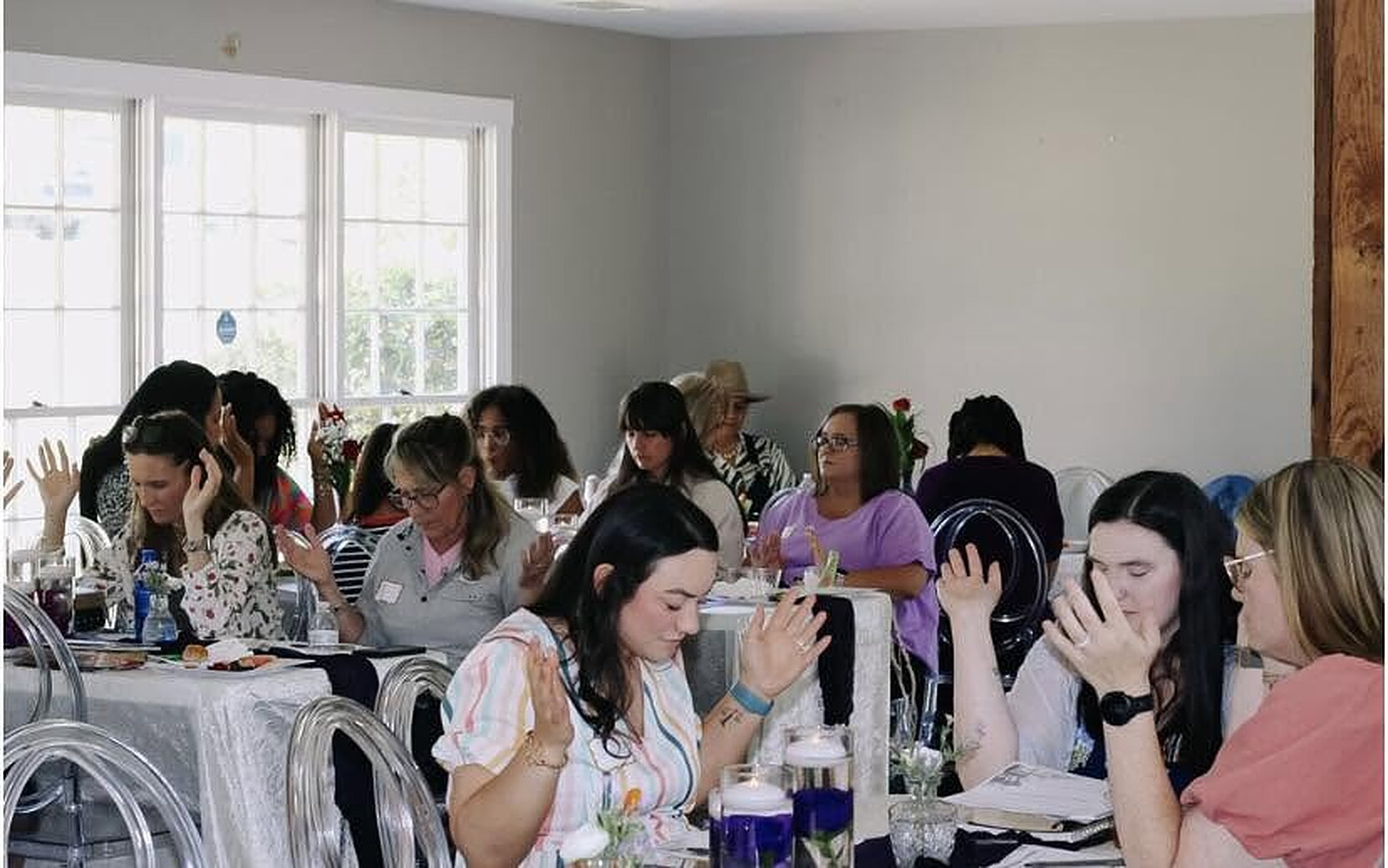 Attendees worshiping with hands raised at the first Vigilant Mama event in Columbus, Georgia
